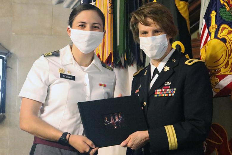 Cadet First Captain Reilly McGinnis (left), on behalf of the Corps, presented Brig. Gen. Cindy Jebb with a scrapbook filled with pictures of her time at West Point and messages submitted by current and former members of the Corps of Cadets.   (left), on behalf of the Corps, presented Brig. Gen. Cindy Jebb with a scrapbook filled with pictures of her time at West Point and messages submitted by current and former members of the Corps of Cadets.  
