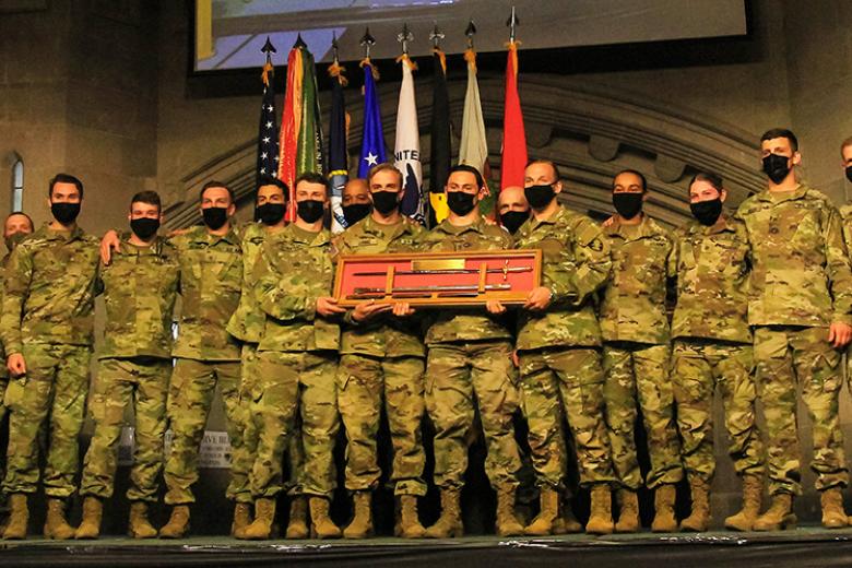 The USMA Black team holds the Reginald E. Johnson Memorial Saber marking its team victory at the post event ceremony. 