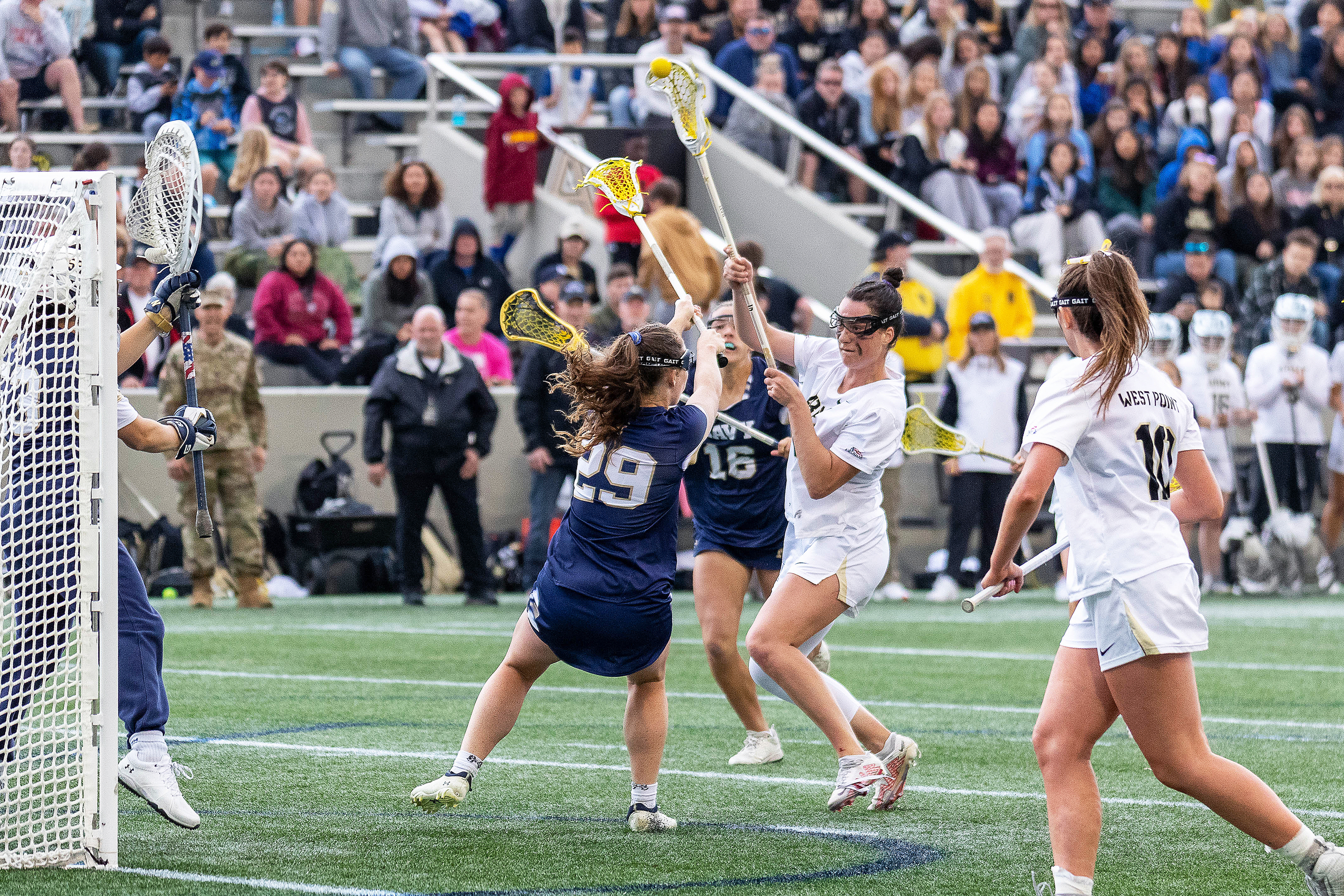 No. 16 Army West Point women's lacrosse (13-2, 7-1 Patriot League) defeated archrival No. 23 Navy (12-4, 6-2 Patriot League) by a score of 15-11 from Michie Stadium on April 22.  Plebe Allison Reilly delivered an all-time performance for the Black Knights, setting new single-game program records with nine goals scored and 12 points total with her three assists. One of four freshman in the starting lineup, Lindsey Serafine made nine saves in the cage while making her second career start.   (Photo by Class of