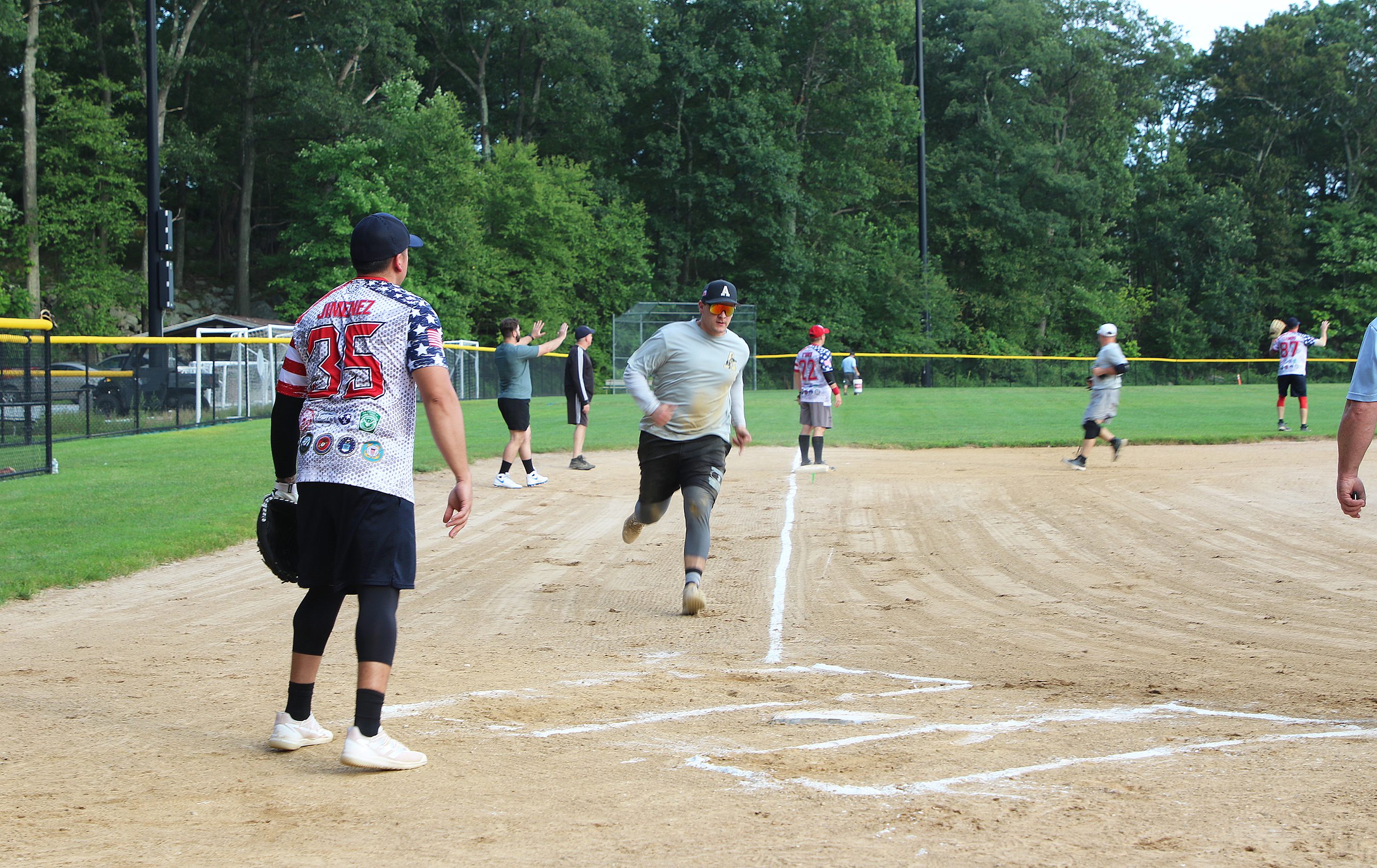 Garrison swept the Directorate of Emergency Services/Military Police (DES/MPs) two games to none in the best-of-three upper bracket championship series to win the West Point Summer Softball League upper bracket Aug. 9 at the Morale, Welfare and Recreation Softball Field #3. The first-seeded Garrison (18-0) won game one, 17-3, and then took the series with a 11-2 win in game two over fourth-seeded DES/MPs (13-11).     (Photo by Maj. David Hoy/USMA PAO)