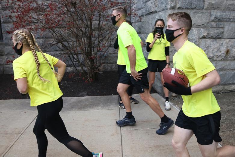 Department of Physical Education Director, Col. Nicholas Gist (center), joins  members of the Army West Point Marathon team during the Army-Navy Ball Run Friday at West Point.
