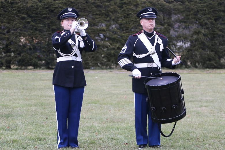 Staff Sgt. Katherine Stephen (bugle) and Master Sgt. Jeff Prosperie (drums) from the West Point Band Field Music Group, The Hellcats, played Taps