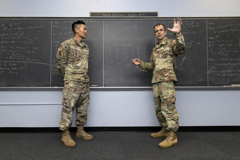 Col. Nicholas Clark and Lt. Col. Andrew Lee, academy professor and associate professor in the Department of Mathematical Sciences, respectively, received $130,000 of a $1.1 million four-year National Science Foundation award to develop tailored educational pathways through the use of sports statistics to teach data science.     (Courtesy photo)