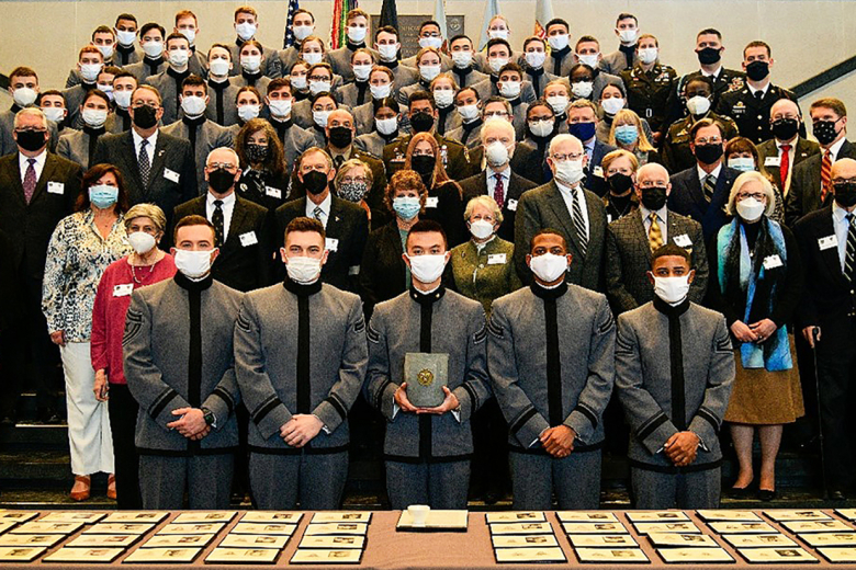 During the annual Ring Melt, hosted by the West Point Association of Graduates, the ringsʼ donors or representatives gather for a photo on Friday at the Eisenhower Hall Theatre. 