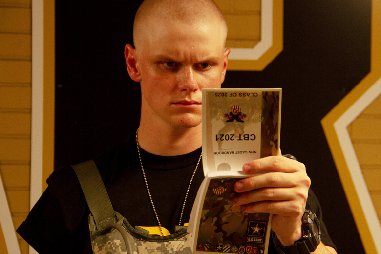 A new cadet reads the New Cadet Handbook during Reception Day at West Point Monday. During the six weeks of Cadet Basic Training, new cadets will be physically and mentally tested as they learn basic combat and leadership skills ahead of the academic year.     Photo by Jorge Garcia/PV
