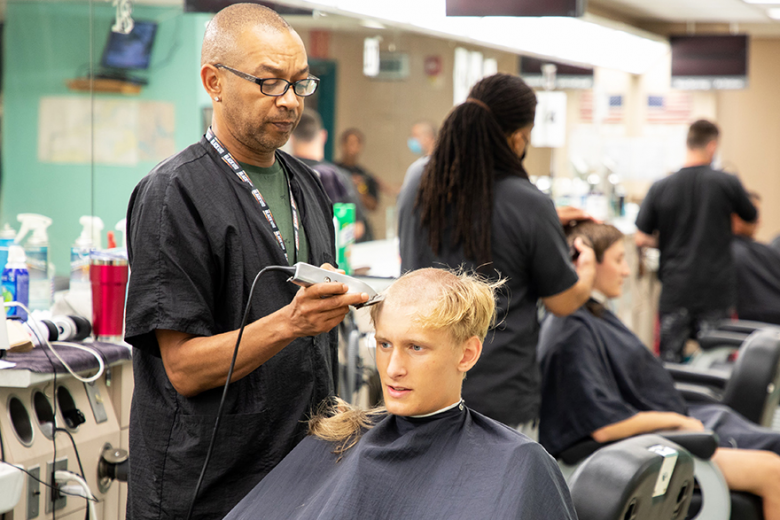 A new cadet receives his first of many haircuts at the U.S. Military Academy during Reception Day Monday. More than 1,200 new cadets will undergo administrative processing, are fitted with their initial military clothing issue, medical and physical evaluations, begin their first lessons in marching, military courtesy and discipline before they begin their six weeks of Cadet Basic Training before beginning the academic year. 