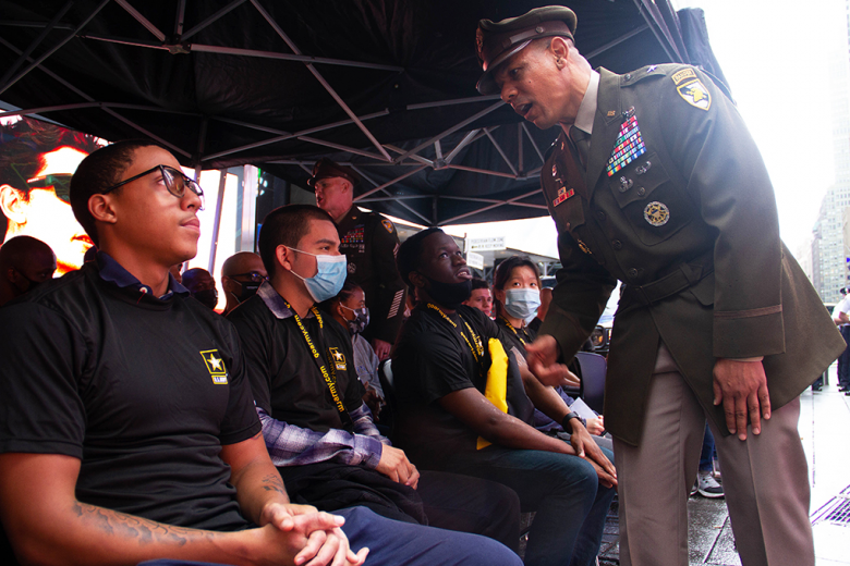Commandant of Cadets, Brig. Gen. Mark Quander, congratulates new Soldiers who enlisted into the U.S. Army Monday during the 246th Army Birthday celebration at Times Square in New York City.  