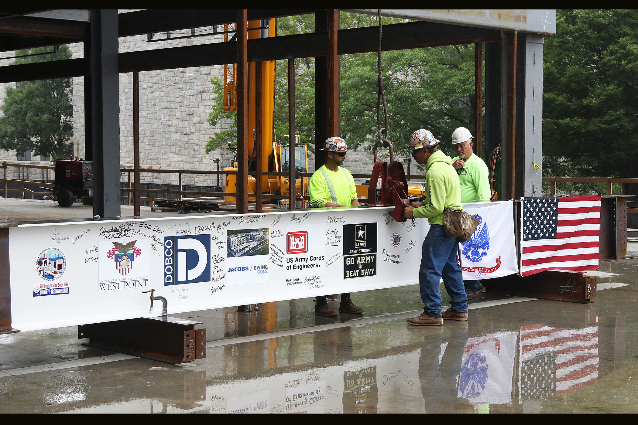 One of the final beams was placed on top of the future Cyber and Engineering Academic Center (CEAC) during a ceremony June 22 at the U.S. Military Academy. Traditionally, a beam topping ceremony is the celebration of the last beam placed on the building and marks a major milestone in the construction process of that building.  (Photo by Eric S. Bartelt/PV)