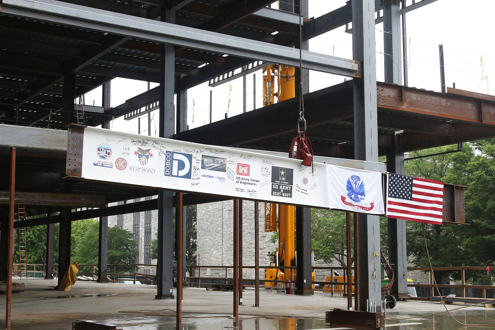 One of the final beams was placed on top of the future Cyber and Engineering Academic Center (CEAC) during a ceremony June 22 at the U.S. Military Academy. Traditionally, a beam topping ceremony is the celebration of the last beam placed on the building and marks a major milestone in the construction process of that building.  (Photo by Eric S. Bartelt/PV)