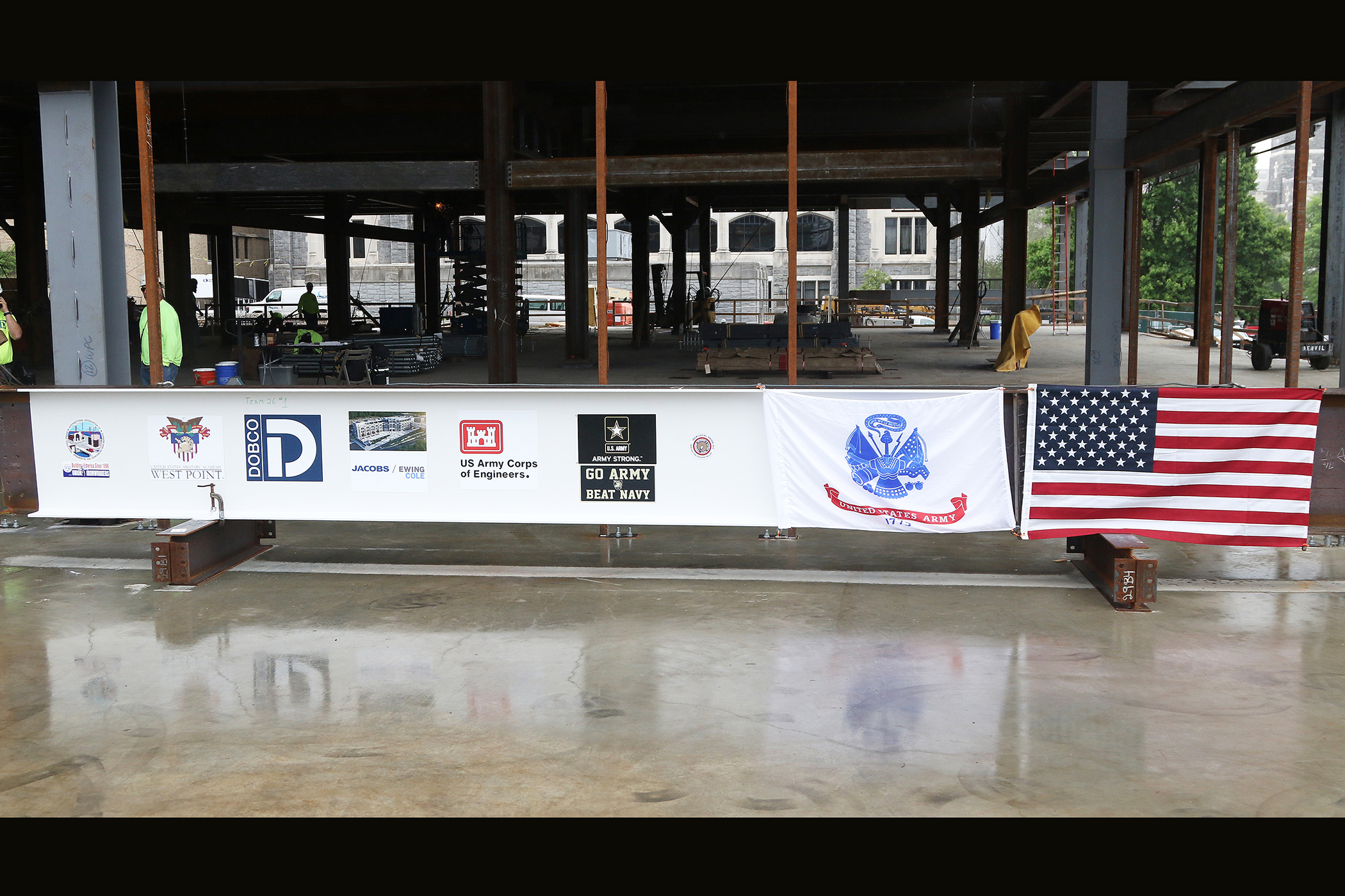 One of the final beams was placed on top of the future Cyber and Engineering Academic Center (CEAC) during a ceremony June 22 at the U.S. Military Academy. Traditionally, a beam topping ceremony is the celebration of the last beam placed on the building and marks a major milestone in the construction process of that building.  (Photo by Eric S. Bartelt/PV)