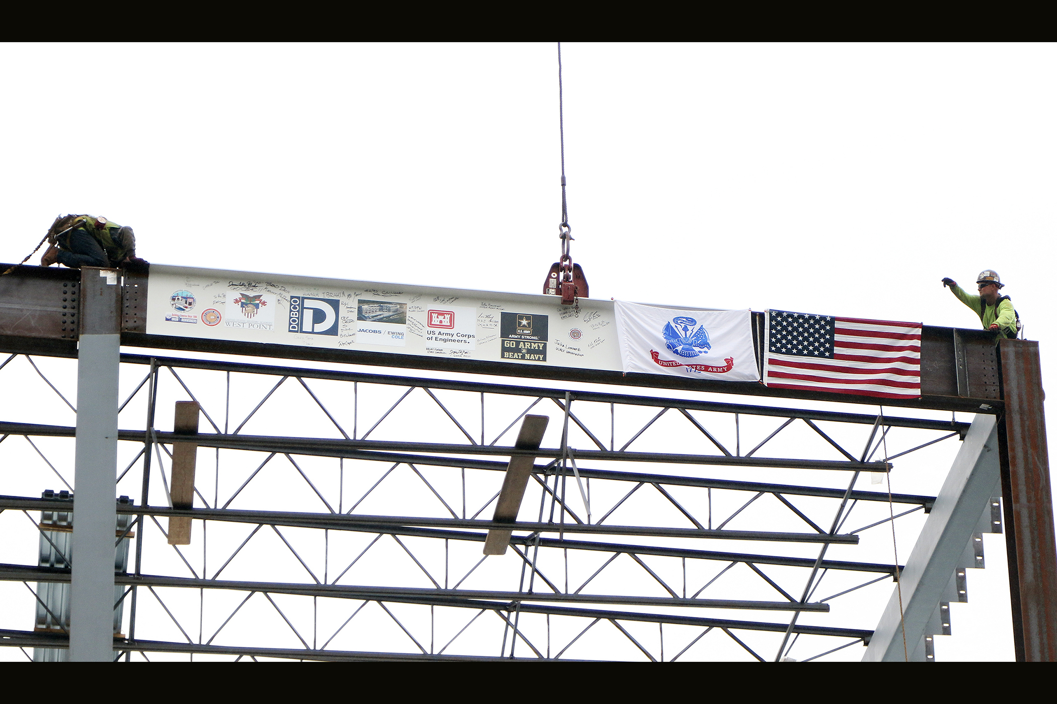 One of the final beams was placed on top of the future Cyber and Engineering Academic Center (CEAC) during a ceremony June 22 at the U.S. Military Academy. Traditionally, a beam topping ceremony is the celebration of the last beam placed on the building and marks a major milestone in the construction process of that building.  (Photo by Eric S. Bartelt/PV)