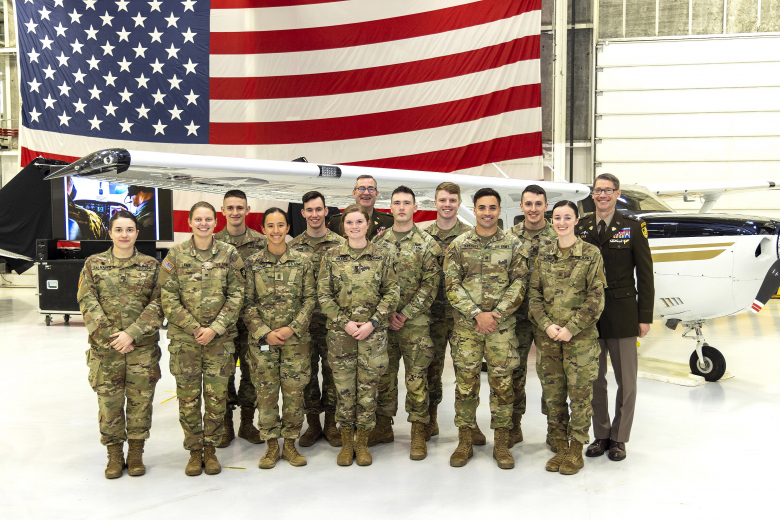 Cadets from the Academic Flight Program with Col. Bret VanPoppel, Department of Civil and Mechanical Engineering deputy head, and Brig. Gen. Shane Reeves, the 15th Dean of the Academic Board, during the Aircraft Dedication Ceremony March 23 at the 2nd Aviation Detachment's Hangar.     (Photo by Christopher Hennen/USMA PAO)
