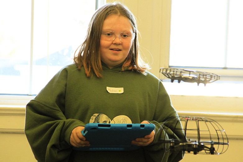  Madison, a student at the Highland Falls Intermediate School, learns to operate a drone.