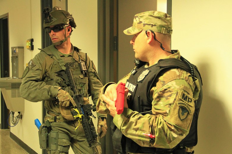 A notional assailant lies unresponsive on the ground after perishing from a self-inflicted gunshot wound during the Full-Scale Exercise on March 22 at the U.S. Military Academy. 