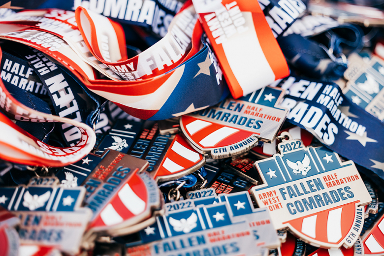 A few hundred runners and ruck marchers competed in the sixth annual Fallen Comrades Half Marathon, hosted by the Army West Point marathon team, Sunday at West Point. The event commemorates graduates who have passed since 2001 during the Global War on Terrorism (bottom center photo). The top runners and ruck marchers of the day were first-place overall and male runner, Class of 2023 Cadet Zack Gould (above photo), who finished in 1:17:10 (5:53 min/mile), and the first-place female runner, Madison Armonda, 