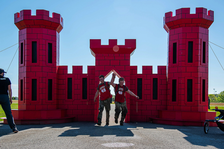 Class of 2021 Cadets Griffin Hokanson (left) and Collin Hahn (right) run through the castle marking their completion of the 14th annual Lt. Gen. Robert B. Flowers Best Sapper Competition May 3 at Fort Leonard Wood, Mo. The two cadets learned about their strengths and weaknesses in military operations and showcased their grit and perseverance while gunning for the top prize between May 1-4. 