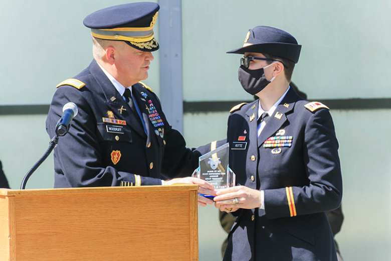 (Left) Col. Todd Woodruff (left) presented the seventh annual Col. Eric Kail Memorial Leadership Award to Capt. Nichole Rotte (right) during the ceremony.  