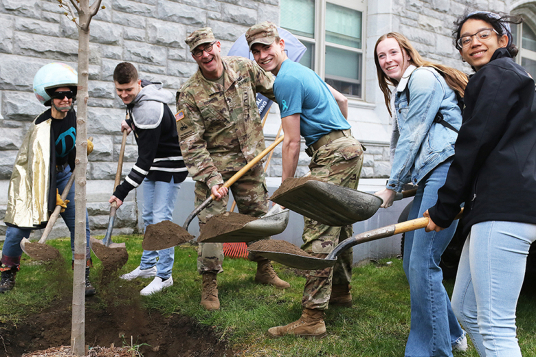 Dean of the Academic Board Brig. Gen. Shane Reeves, who also read the Arbor Day proclamation (bottom left), accompanied by cadets and Dirt Woman helped place dirt around the new tree.