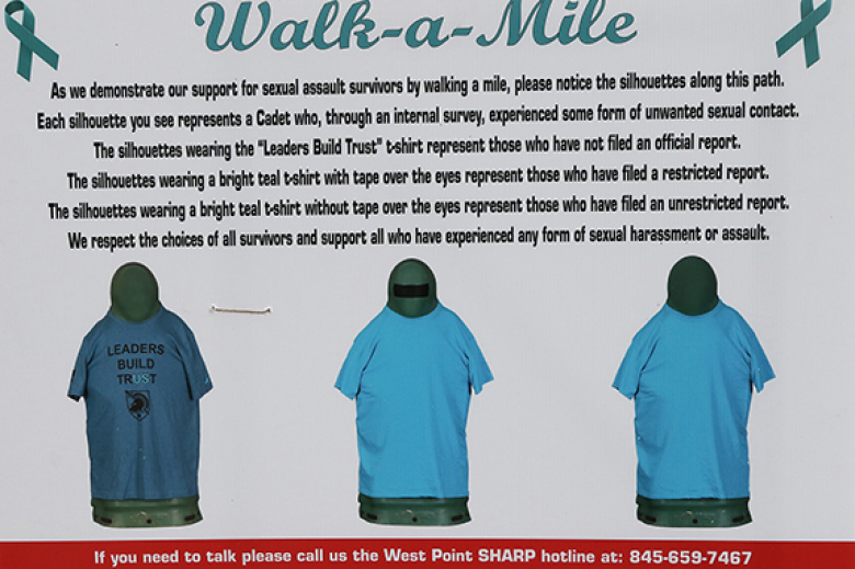 Those who trekked the Walk A Mile viewed silhouettes along the path wearing T-shirts that represented cadets who experienced some form of unwanted sexual contact.