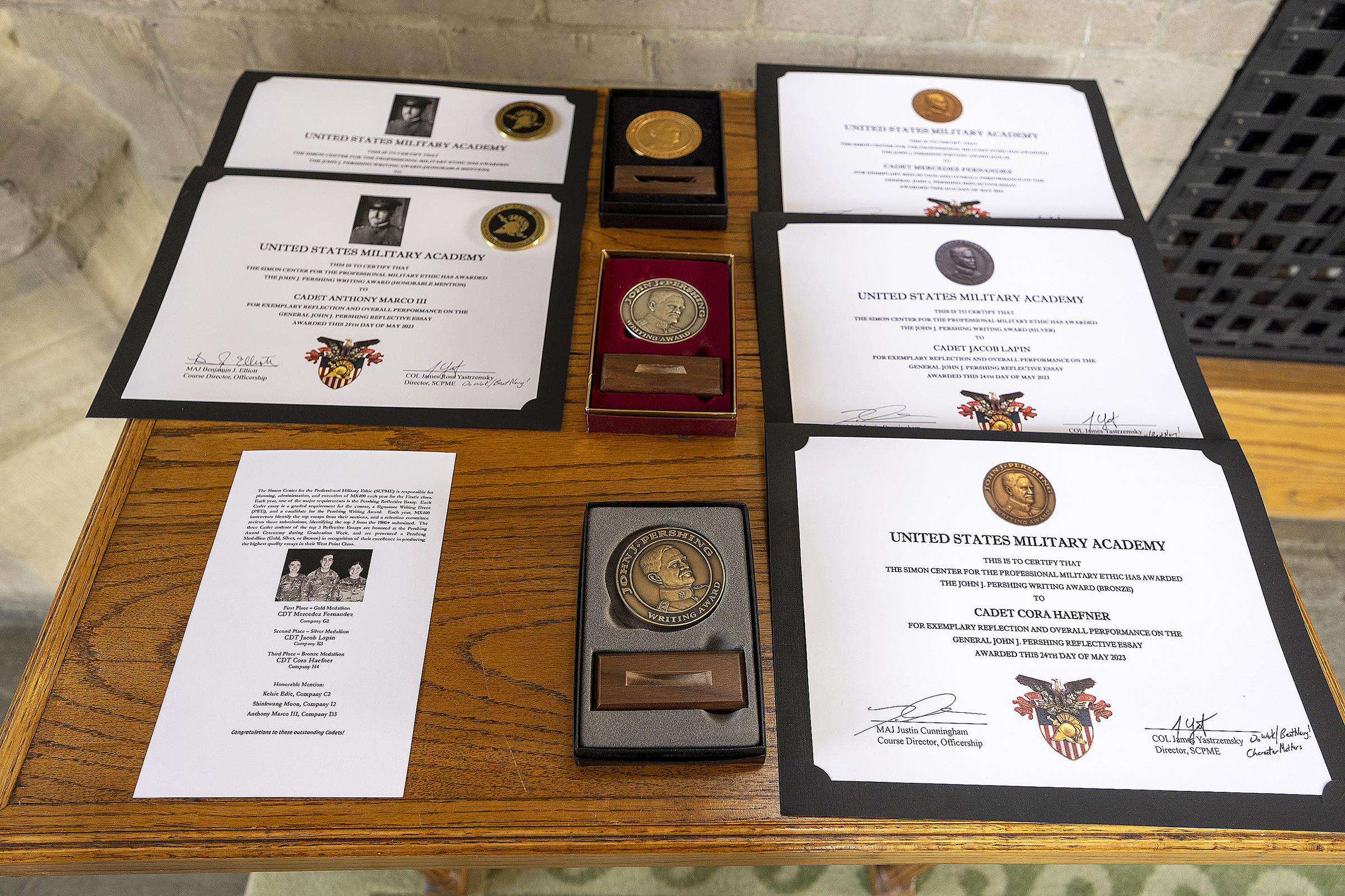 The Simon Center for the Professional Military Ethic (SCPME) hosted the 17th annual Gen. John J. Pershing Writing Award Ceremony May 24 at the Thayer Award Room. The award recognition ceremony acknowledged the top Firstie cadet awardees: Mercedez Fernandez (first place/gold medal), Jacob Lapin (second place/silver medal), Cora Haefner (third place/bronze medal) and honorable mention recipients Kelsie Edie and Anthony Marco III. Honorable mention awardee Shinkwang Moon was not present at the ceremony.