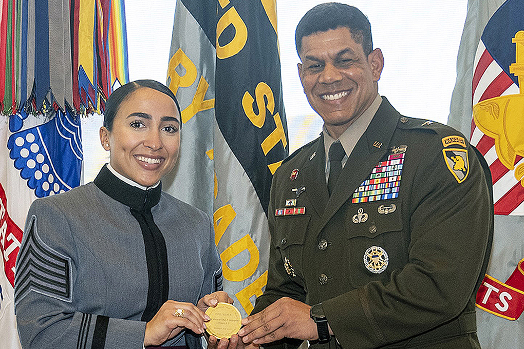 Class of 2022 Cadets Mennat-Allah T. Mohamed (right) and Carter J. Macias (left) receive their medals from the Commandant of Cadets, Brig. Gen. Mark Quander, during the 10th annual Lt. Gen. Hal Moore Warrior Athlete of Excellence Award Nov. 10 in the Haig Room, Jefferson Hall.   Photos by Christopher Hennen/USMA PAO	