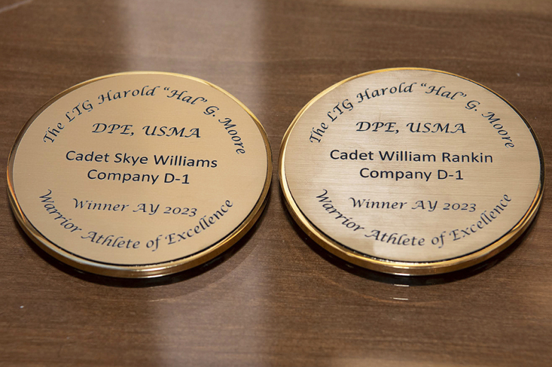 Class of 2023 Cadets Skye Williams and William Rankin receive the Lt. Gen. Harold “Halˮ G. Moore Warrior Athlete of Excellence Award medals (right) on Nov. 9 in the Thayer Award Room.  (Photo by Kyle Osterhoudt/USMA PAO)
