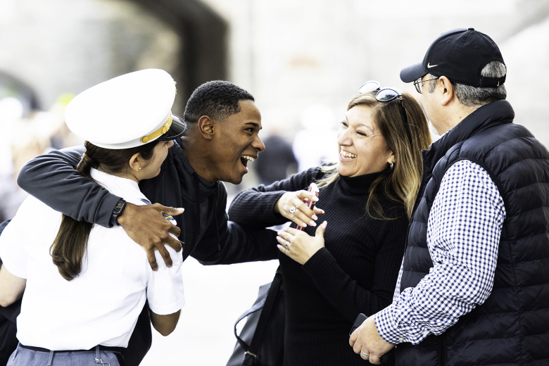 A cadet reconnects with her family during Family Weekend Friday in Cadet Central Area at West Point. 			 Photo by Elizabeth Woodruff/USMA PAO