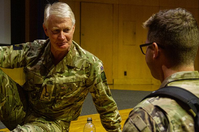 Lt. Gen. Sir Ralph Wooddisse speaks informally to a cadet after he concluded his discussion with the Corps of Cadets during the annual Kermit Roosevelt lecture. 