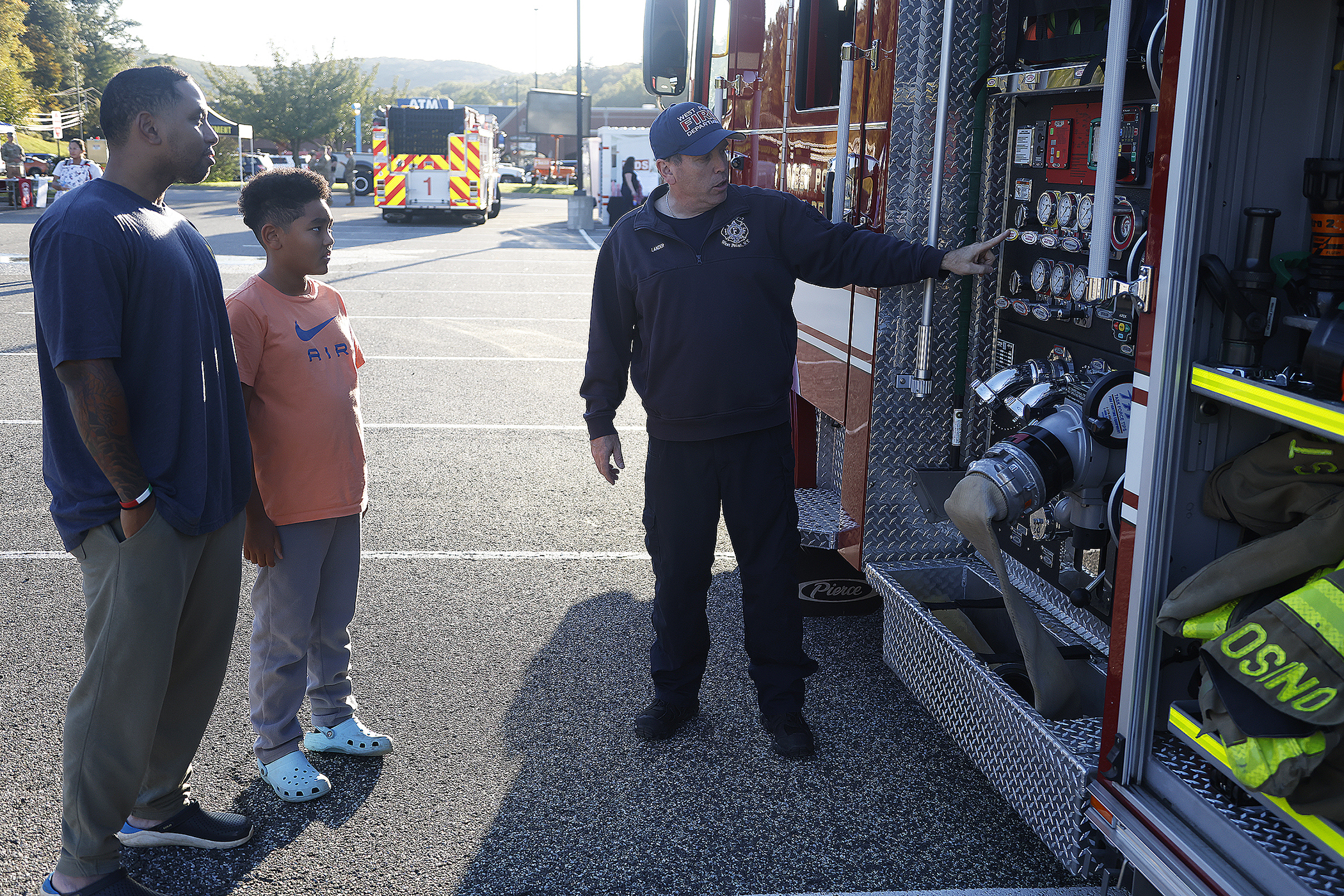 The West Point Fire Department (WPFD) presented its annual Open House for the West Point community Oct. 11 at H Lot in the Post Exchange parking lot. The WPFD offered activities to the children including the Kids Firefighting Obstacle Course with firefighting gear, Fire Extinguisher Training, Bounce House, Fire Truck displays, Cornhole, Dunk a Firefighter and the announcement of the Fire Prevention Week Poster Contest winners.   (Photo by Eric S. Bartelt/PV)