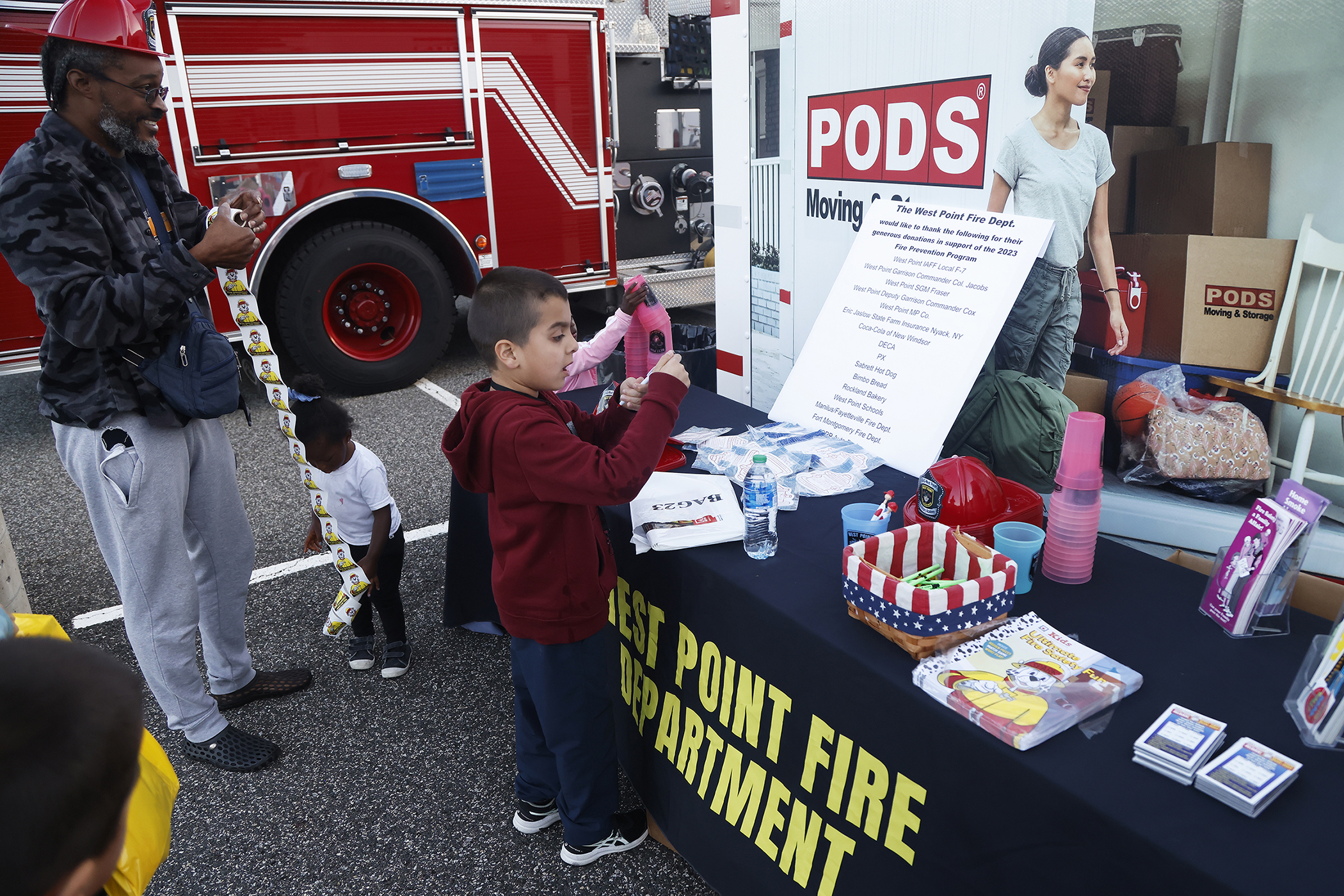 The West Point Fire Department (WPFD) presented its annual Open House for the West Point community Oct. 11 at H Lot in the Post Exchange parking lot. The WPFD offered activities to the children including the Kids Firefighting Obstacle Course with firefighting gear, Fire Extinguisher Training, Bounce House, Fire Truck displays, Cornhole, Dunk a Firefighter and the announcement of the Fire Prevention Week Poster Contest winners.   (Photo by Eric S. Bartelt/PV)