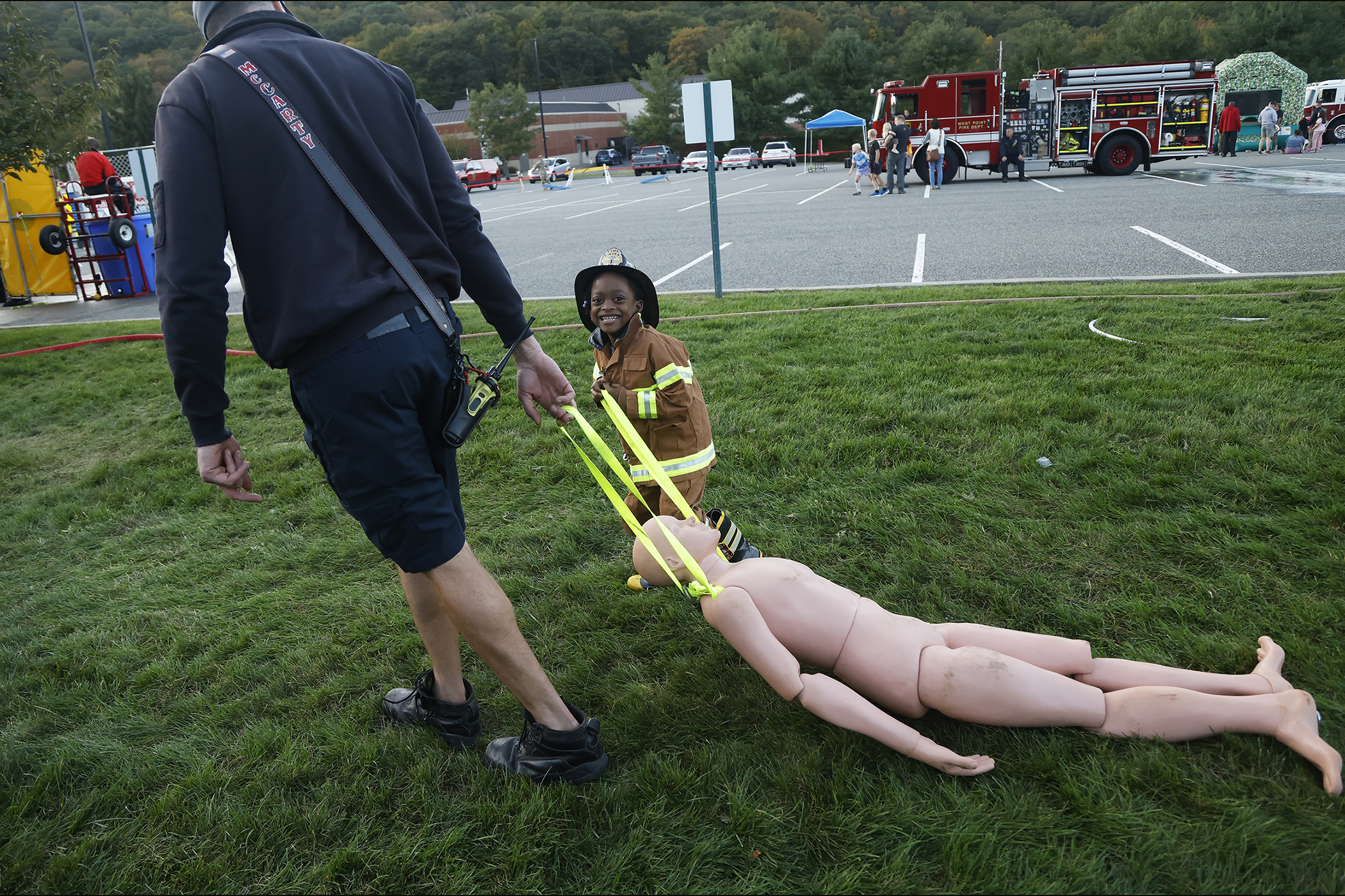 The West Point Fire Department (WPFD) presented its annual Open House for the West Point community Oct. 11 at H Lot in the Post Exchange parking lot. The WPFD offered activities to the children including the Kids Firefighting Obstacle Course with firefighting gear, Fire Extinguisher Training, Bounce House, Fire Truck displays, Cornhole, Dunk a Firefighter and the announcement of the Fire Prevention Week Poster Contest winners.   (Photo by Eric S. Bartelt/PV)