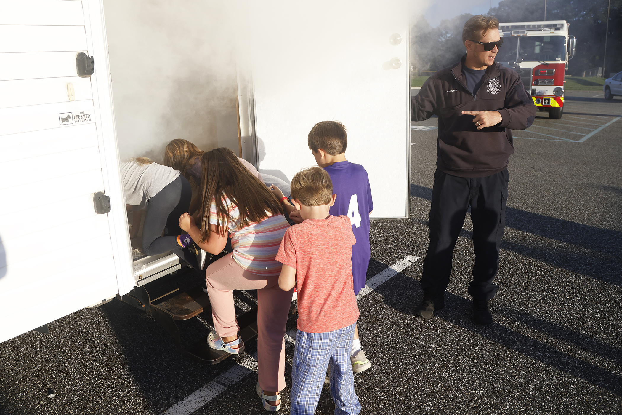 The West Point Fire Department (WPFD) presented its annual Open House for the West Point community Oct. 11 at H Lot in the Post Exchange parking lot. The WPFD offered activities to the children including the Kids Firefighting Obstacle Course with firefighting gear, Fire Extinguisher Training, Bounce House, Fire Truck displays, Cornhole, Dunk a Firefighter and the announcement of the Fire Prevention Week Poster Contest winners.   (Photo by Eric S. Bartelt/PV)