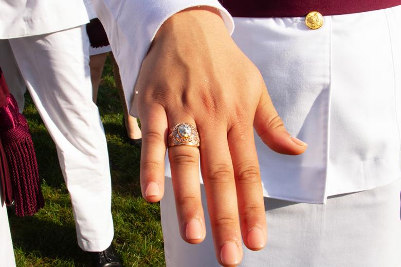 A Class of 2022 cadet shows off her class ring after the Ring Weekend ceremony Friday at the Trophy Point Amphitheater. 