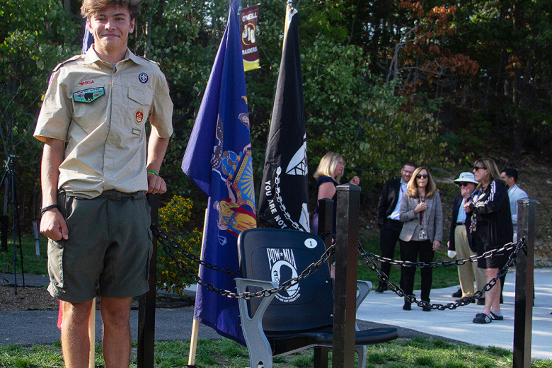 James I. O'Neill High School faculty and community members gathered at Waldo Wood Memorial Field to witness West Point Troop 23 Eagle Scout candidate Chad Haley Jr.ʼs (above) presentation as he unveiled the completion of the Prisoner of War/Missing in Action Honor chair dedicated to veterans in the West Point community and across the Nation on Friday. Through a collaboration with the Hussey Seating Chair Company and other community members, Haley Jr. facilitated the ambitious project, as part of his Eagle