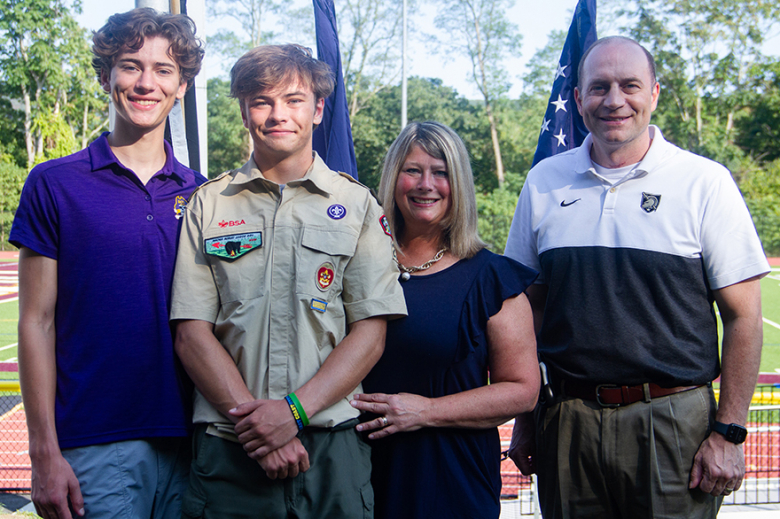 James I. 'Neill High School faculty and community members gathered at Waldo Wood Memorial Field to witness West Point Troop 23 Eagle Scout candidate Chad Haley Jr.ʼs (above) presentation as he unveiled the completion of the Prisoner of War/Missing in Action Honor chair dedicated to veterans in the West Point community and across the Nation on Friday. Through a collaboration with the Hussey Seating Chair Company and other community members, Haley Jr. facilitated the ambitious project, as part of his Eagle 