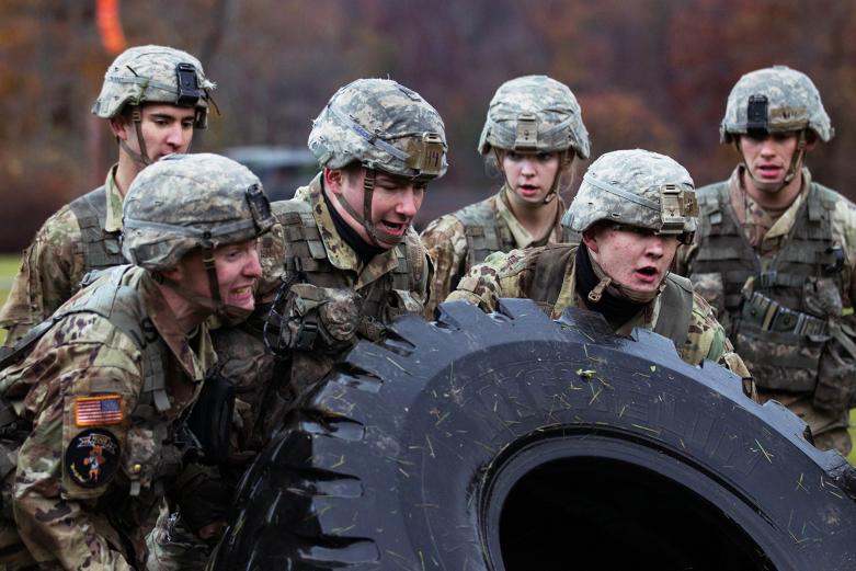 Cadets from the Company H-4 team try to flip a tire during the Team Challenge Event Friday at the Fall Sandhurst Competition. The Team Challenge Event includes the tire flips, a High Mobility Multipurpose Wheeled Vehicle (HMMWV) push/pull and log squats.