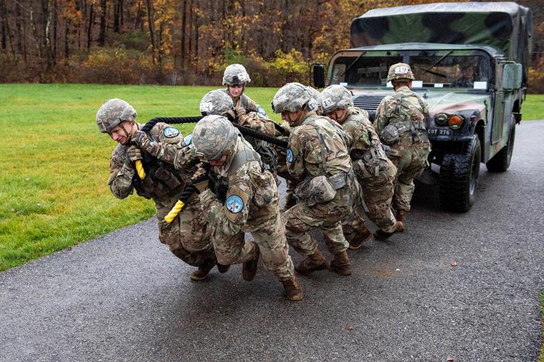 Cadets from the Company I-4 team perform a High Mobility Multipurpose Wheeled Vehicle (HMMWV) pull during the Team Challenge Event Friday at the Fall Sandhurst Competition. 