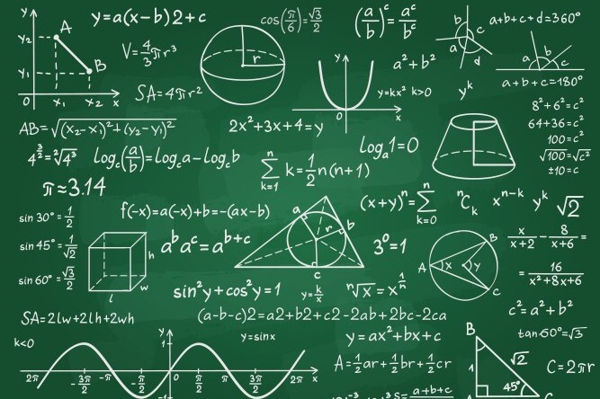 chalkboard filled with calculations