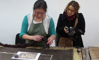 Alexis at her workshop with the Tumar Art Group looking at felt production.