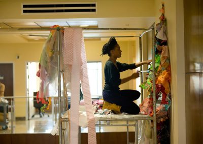 Maya Asante installing her work in the U.S. Embassy Antananarivo