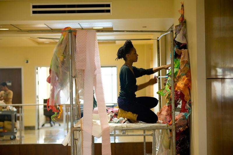 Maya Asante installing her work in the U.S. Embassy Antananarivo