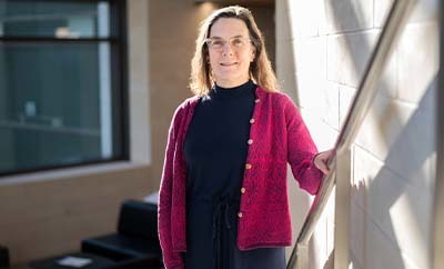Elizabeth Tyler-Kabara stands for a portrait inside the Dell Medical School campus.