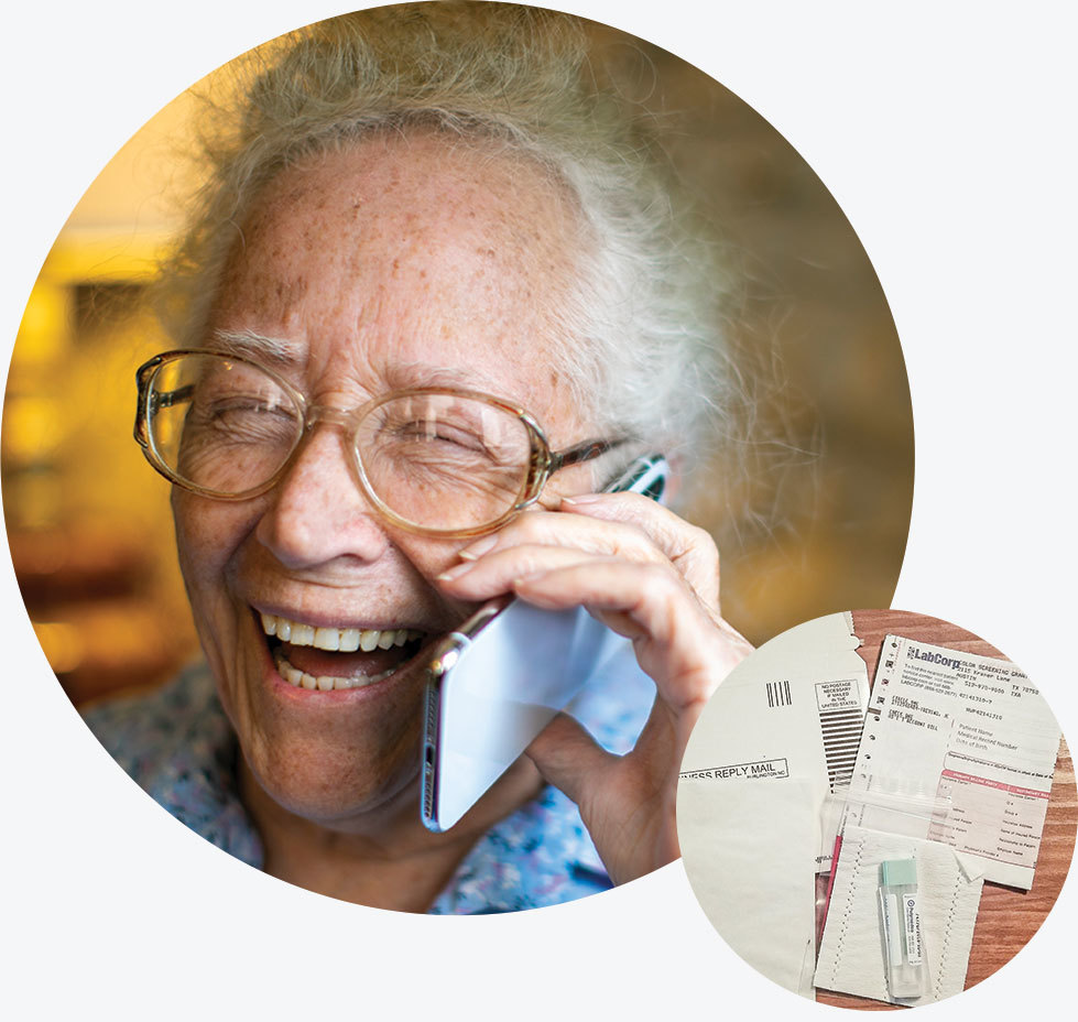 An older man talks on the phone next to a sample colorectal cancer screening kit.