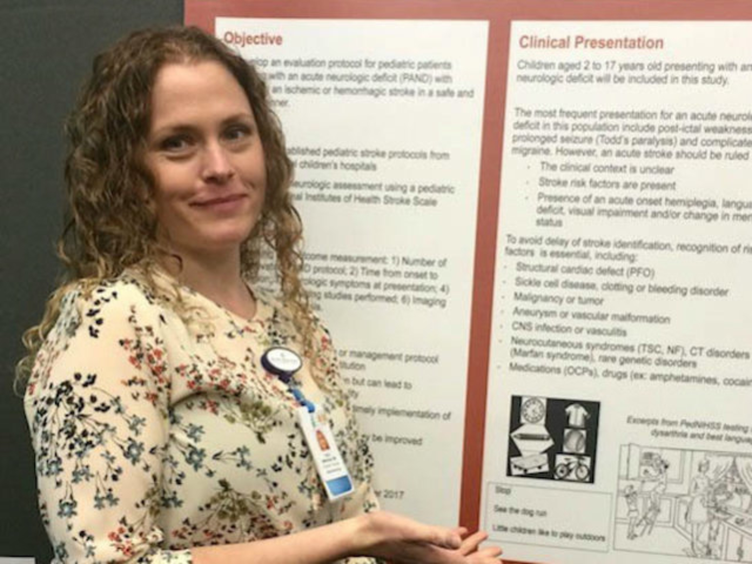 A resident presenting a research poster.