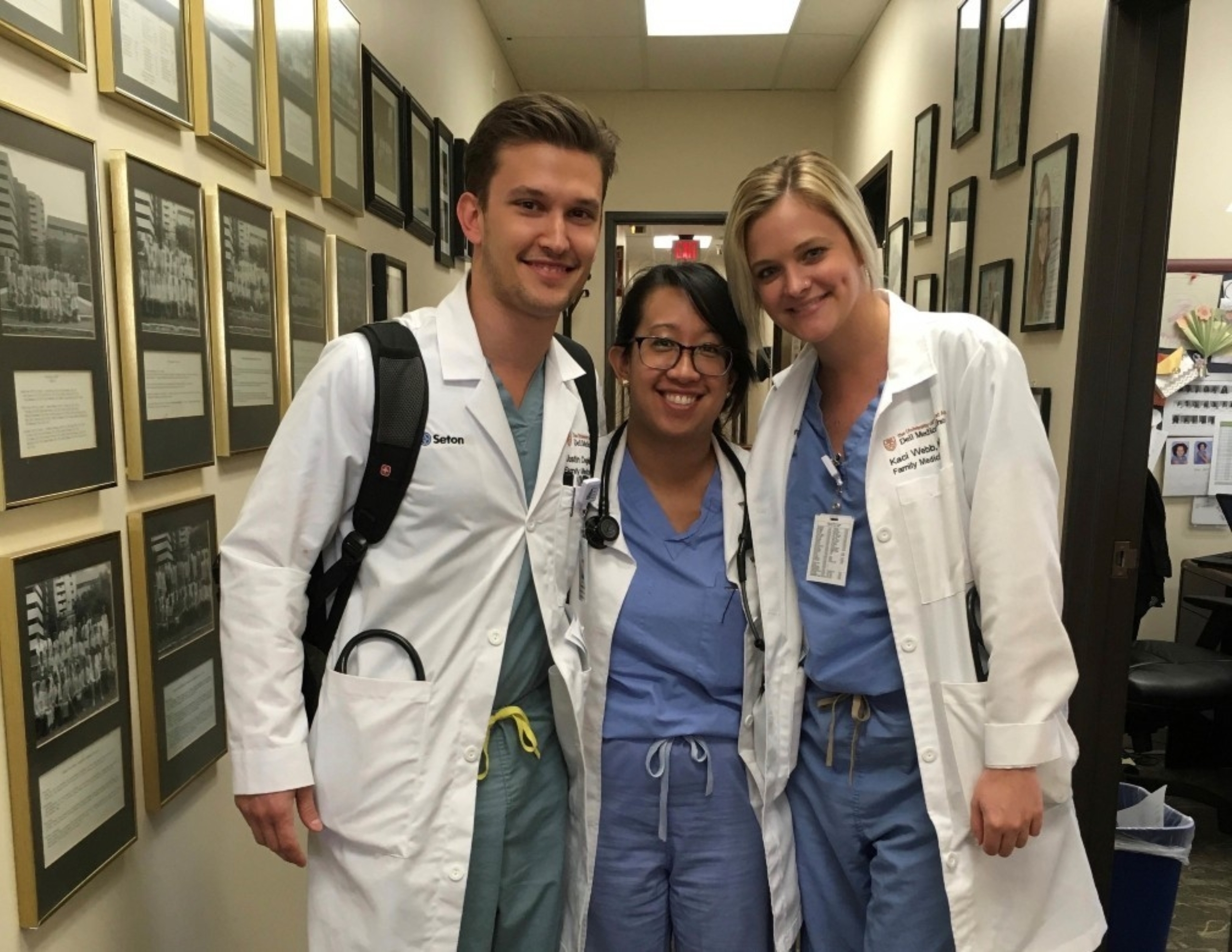 Three residents in scrubs.