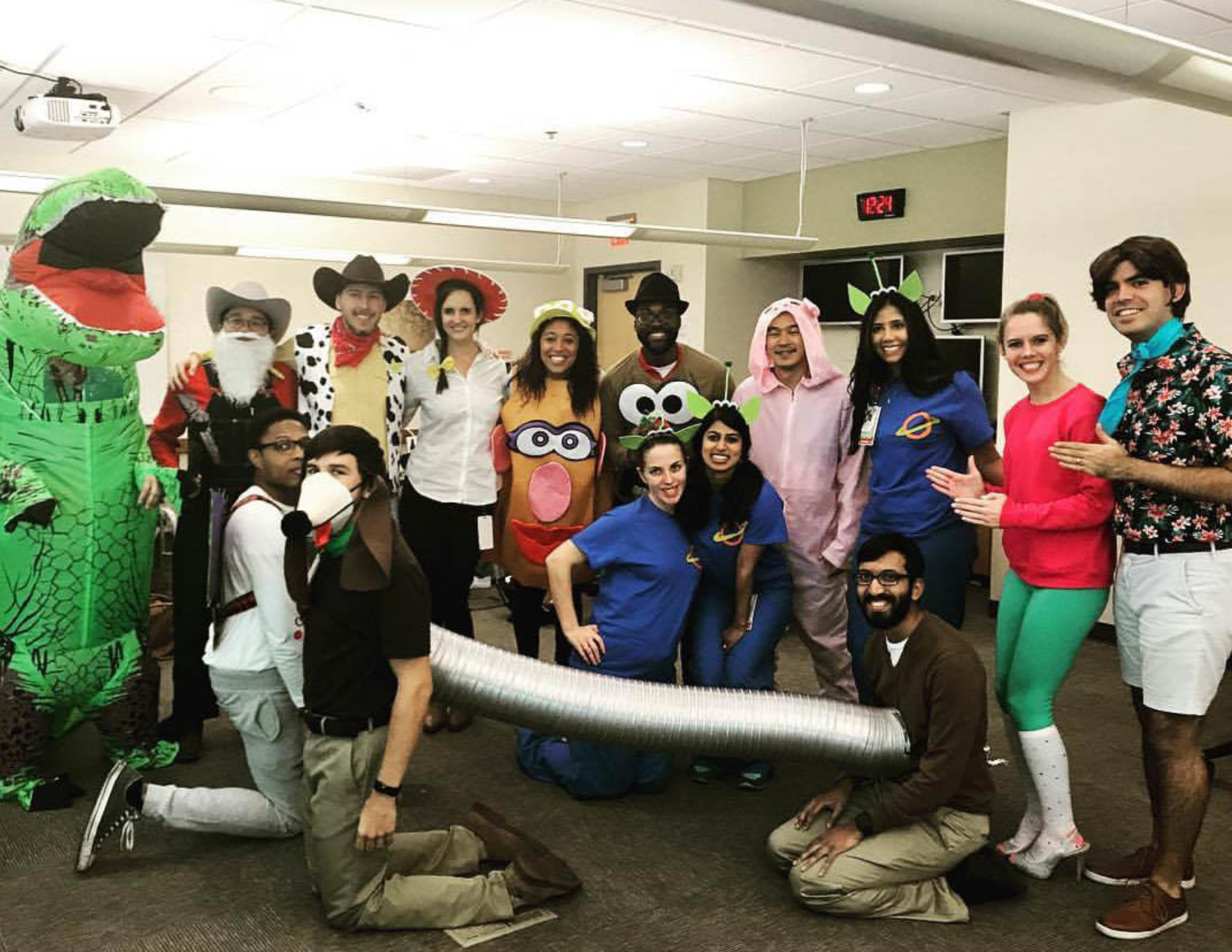 Residents wearing costumes in an office.