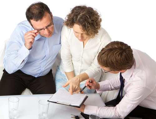 Counselor going over paperwork with couple.