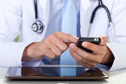 Healthcare professional using a smartphone.