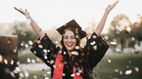 A woman celebrates her college graduation.