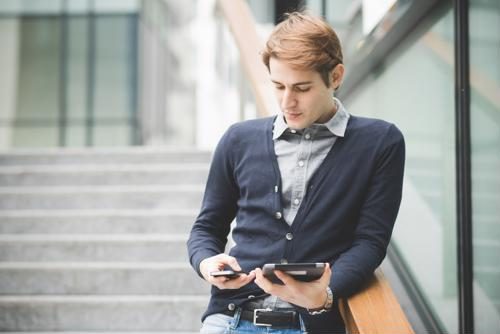 Male student in business casual wear.